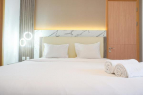 Comfort and Modern Look 2BR at 26th Floor Samara Suites Apartment By Travelio